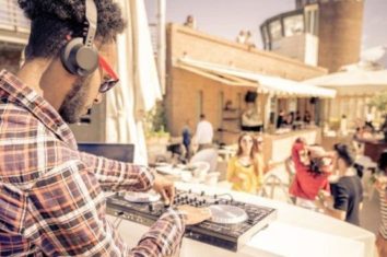 DJ playing music outside at a party