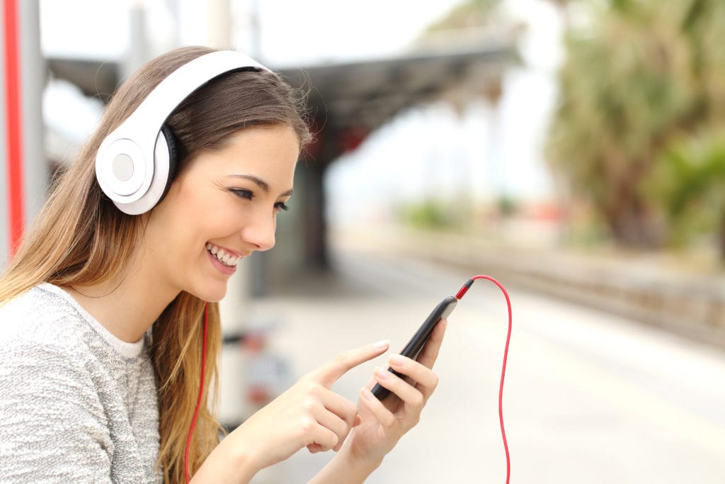 girl with headphones listening to music