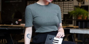 A woman putting her midi keyboard back in its bag