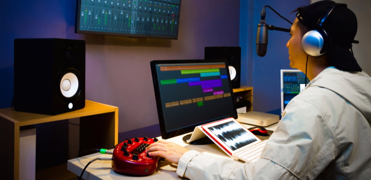 a guy recording in the studio