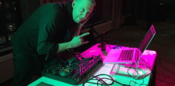a man making music with a dj controller