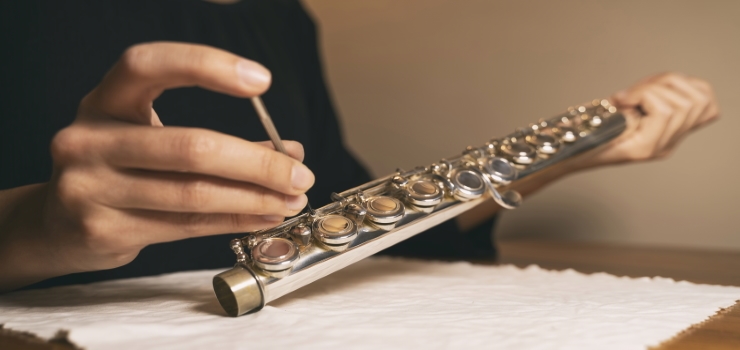 removing the screws from a flute