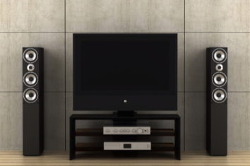 television with one floor standing speaker each side of it